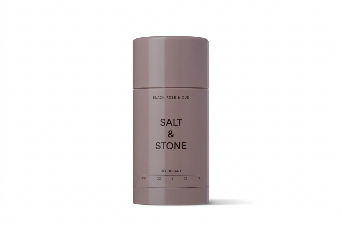 Deodorant stick by Salt & Stone on a white background with 'Jauns Iepakojums' text.
