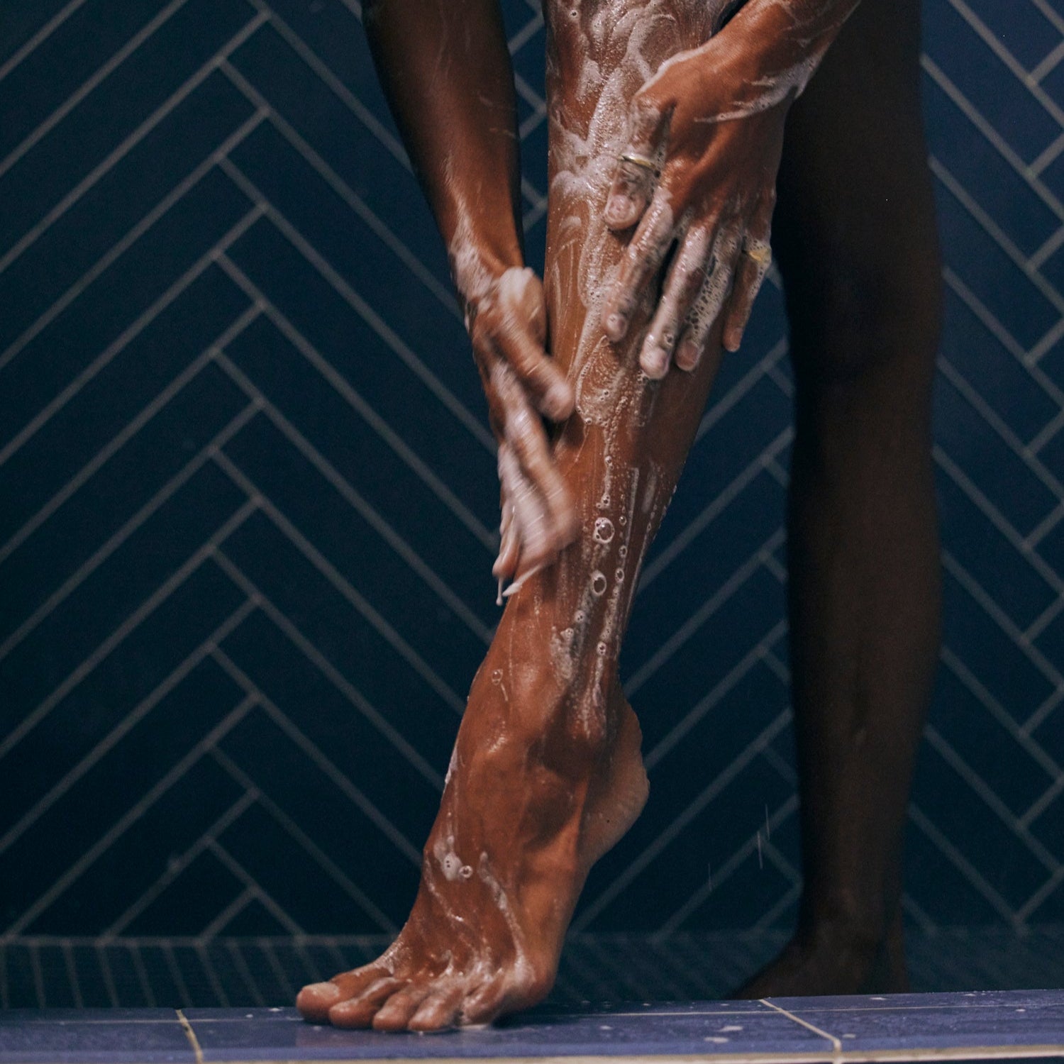 Women washing with Salt & Stone shower gel 
